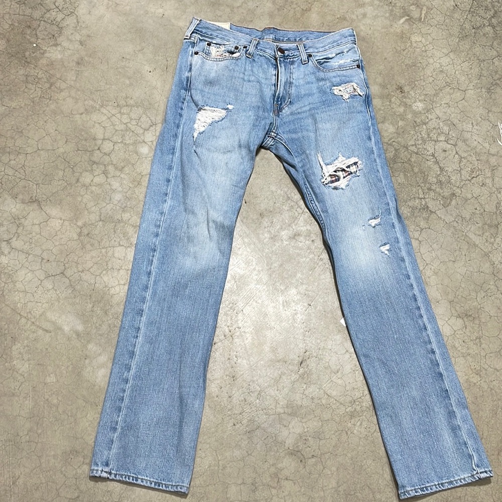 Holistic ripped jeans with flannel underneath